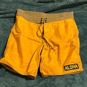 Limited edition birdwell board shorts. Size 35. Mustard yellow
